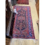 A Caucasian blue ground rug, 200 x 110cm