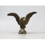 A bronze figure of an eagle with wings spread, 10cm high