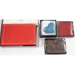 A set of two Asprey leather address books (initialled), an Asprey snakeskin wallet, a Loewe brown