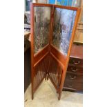An Edwadian mahogany two fold screen inset with printed hunting scenes, each panel width 54cm,