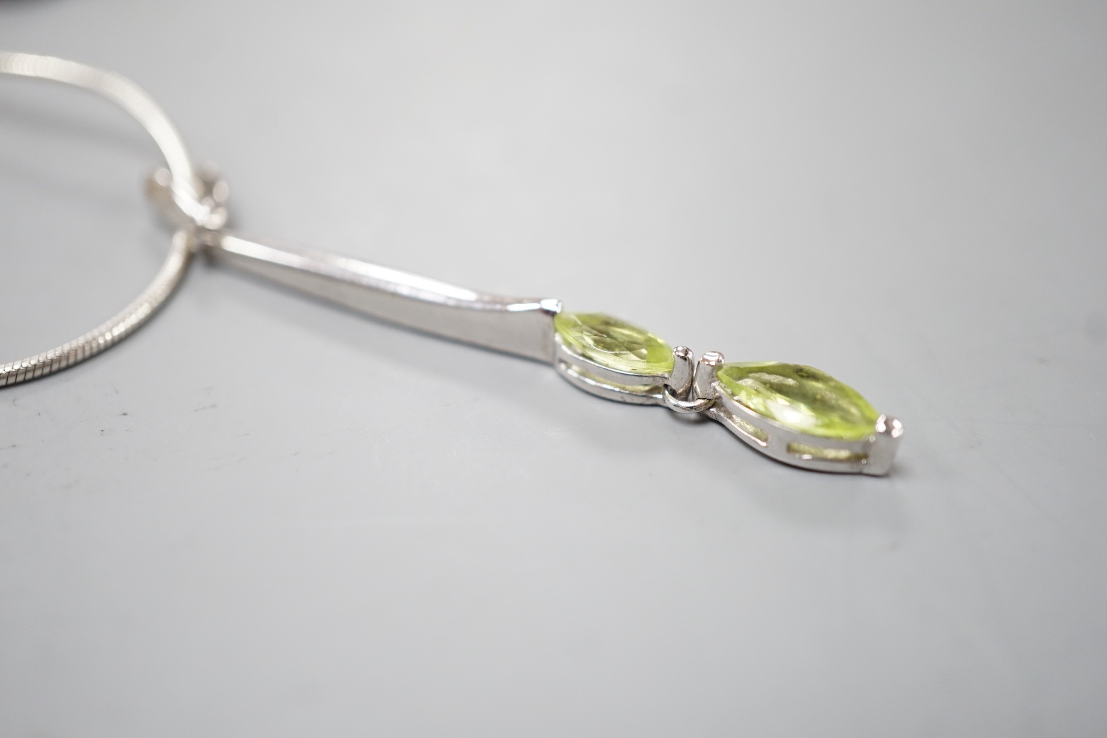 A modern 925 and two stone peridot set pendant,53mm, on a 925 chain, 42cm. - Image 2 of 3
