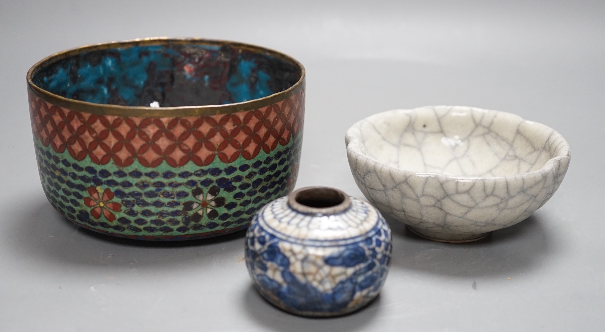 A Chinese crackle ware bowl a blue and white ink pot and a cloisonné enamel cover, crackle ware bowl