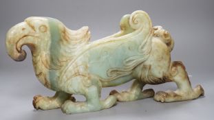 A large Chinese bowenite jade figure of a winged mythical beast, 46cm long