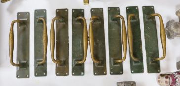 A set of 8 large bronze door handles, 30cm long