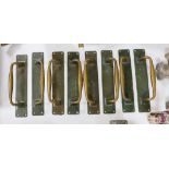 A set of 8 large bronze door handles, 30cm long