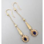 A pair of yellow metal, sapphire and seed pearl set drop earrings. 41mm, gross weight 3.4 grams.