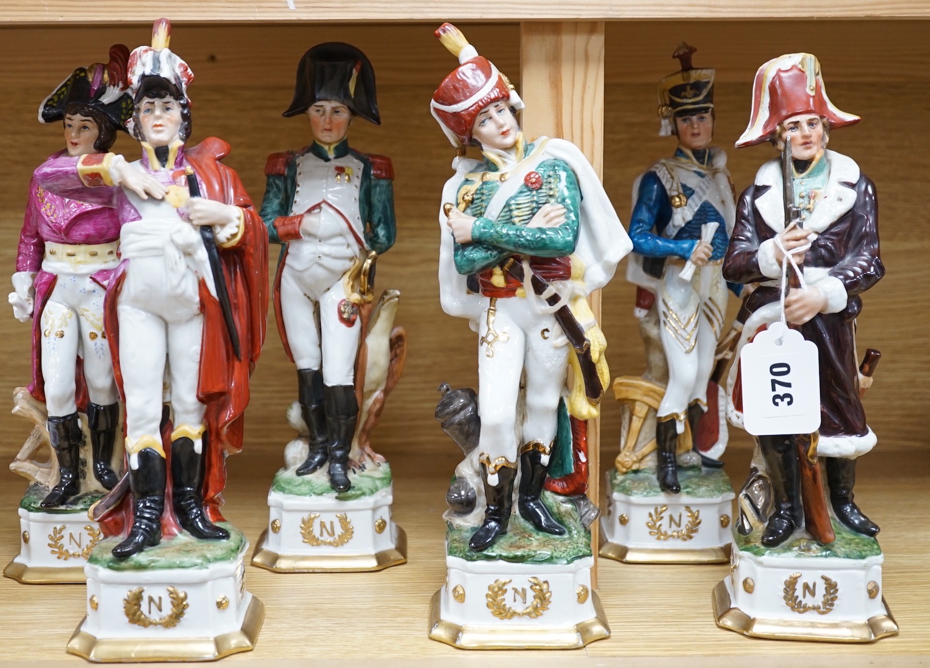 Six continental porcelain figures of soldiers, 32cm