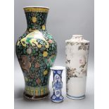 A Chinese famille noire vase, a Chinese blue and white small gu vase and a Japanese cylindrical