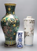 A Chinese famille noire vase, a Chinese blue and white small gu vase and a Japanese cylindrical