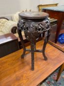 A Chinese circular carved hardwood marble topped jardiniere stand, height 62cm