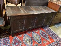 An early 18th century carved oak West Country coffer, length 152cm, depth 58cm, height 71cm