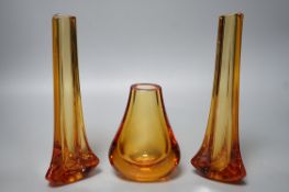 Whitefriars glass - a pair of amber coloured vases and another, 23.5cm
