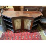 A Regency mahogany side cabinet, the concave centre enclosed by gilt grille doors, width 139cm,