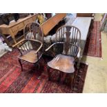 Two 19th century elm and ash Windsor elbow chairs, on front cabriole legs and crinoline