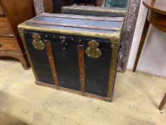 A Victorian brass and oak mounted black leather travelling trunk, length 75cm, depth 36cm, height