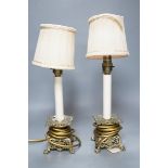 A pair of late 19th century converted brass lamps