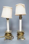 A pair of late 19th century converted brass lamps