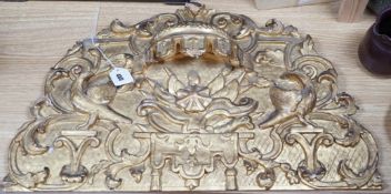 An 18th/19th century Continental gilt wood mirror or niche pediment, 38x65cm