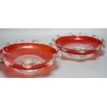 A pair of early 20th century ‘fancy’ glass dishes with inset coins to base, 29cm diameter