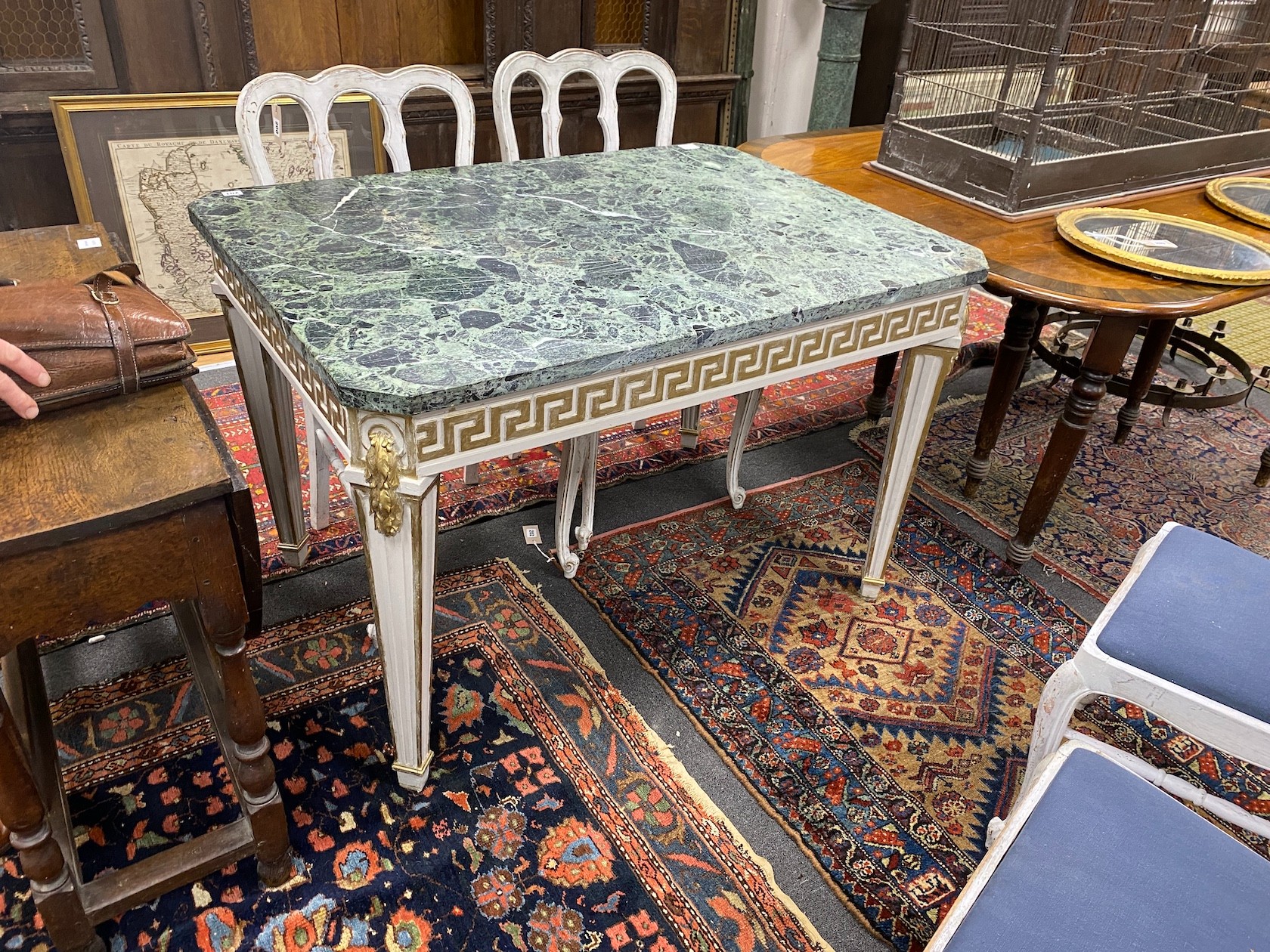 A William Kent style cream and gilt painted side table, with a green variegated marble top, width