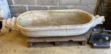 A South East Asian carved stone trough with twin lion mask decoration, width 184cm, depth 61cm,