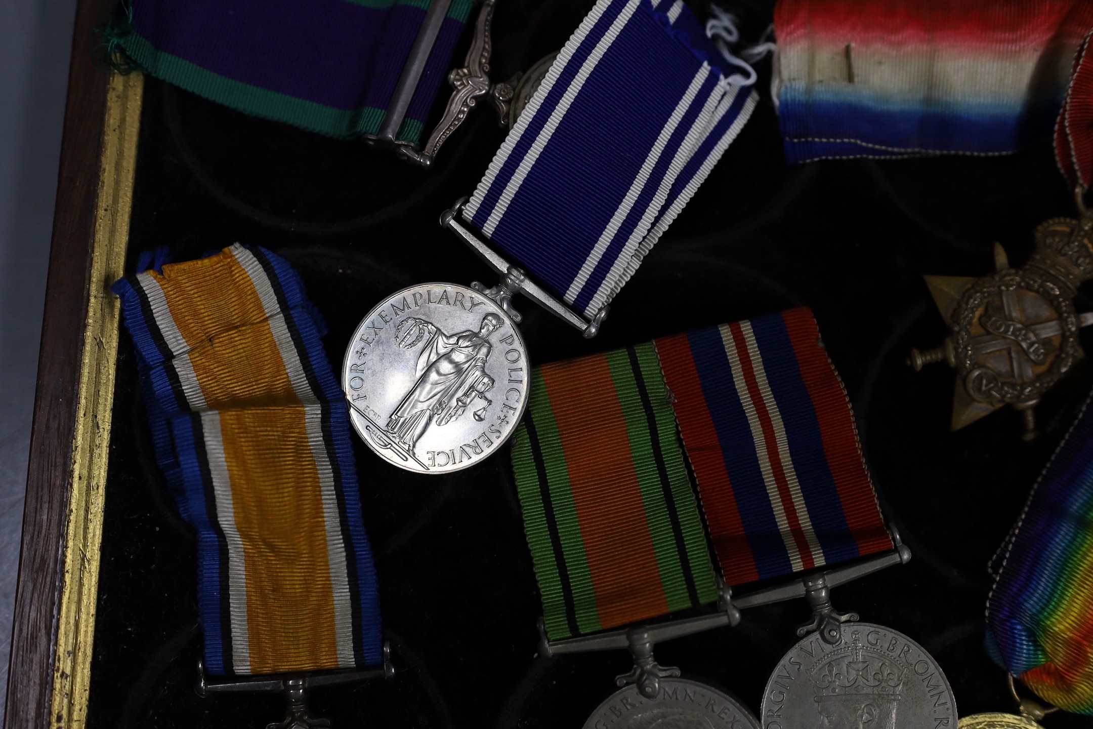 A WWI to Elizabeth II family medal group including WWI trio GSM with Borneo clasp, QEII Police medal - Image 3 of 4