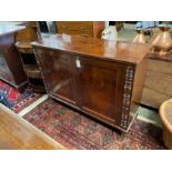 An early VIctorian mahogany two door side cabinet, width 124cm, depth 44cm, height 92cm