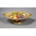 A Royal Worcester fruit painted footed dish, c. 1930, by T. Lockyer. 32cm wide