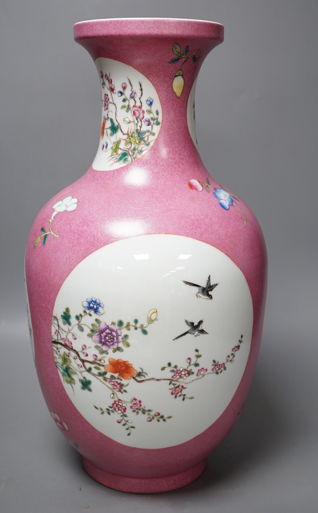 A large Chinese famille rose ruby ground vase, seal mark, 42cm
