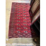 A Bokhara red ground rug, woven with rows of boteh, 160 x 120cm