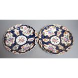 A fine pair of Worcester blue scale plates gilded with mirror like panels, painted with flowers,