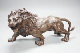 A 20th century bronze figure of a lion, 30cm long