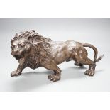 A 20th century bronze figure of a lion, 30cm long