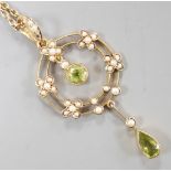 An Edwardian 9ct, peridot and seed pearl cluster set drop pendant necklace, pendant 49mm, chain