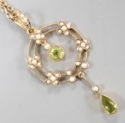 An Edwardian 9ct, peridot and seed pearl cluster set drop pendant necklace, pendant 49mm, chain