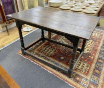 An early 18th century oak rectangular topped side table, width 111cm, depth 68cm, height 74cm