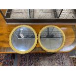 A pair of Victorian oval giltwood and composition wall mirrors, width 39cm, height 45cm