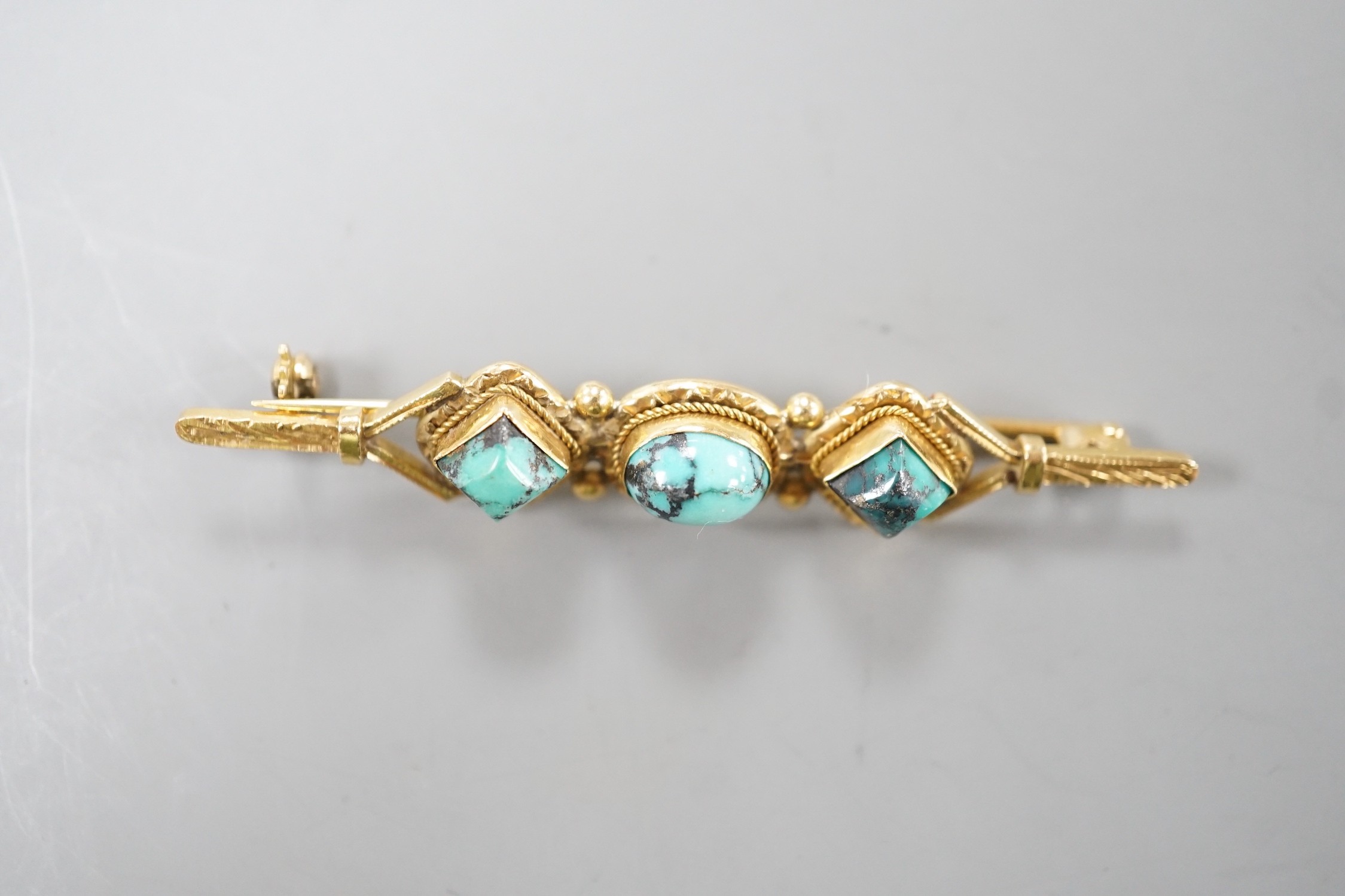 A 750 yellow metal and three stone shaped turquoise set bar brooch, 57mm, gross weight 6.6 grams. - Image 2 of 3