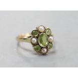 An early 20th century yellow metal, peridot and split pearl cluster set dress ring, size N, gross