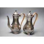 A matched early 20th century silver cafe au lait pair, London, 1900 & 1903, one by Edward Charles