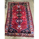 A North West Persian red ground carpet, 250 x 160cm