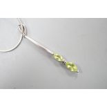 A modern 925 and two stone peridot set pendant,53mm, on a 925 chain, 42cm.