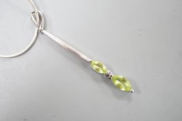 A modern 925 and two stone peridot set pendant,53mm, on a 925 chain, 42cm.