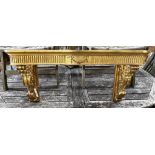 An 18th century style carved giltwood and composition console table (lacks marble top), width