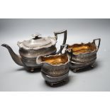 A George III Scottish silver three piece tea set, George McHattie, Edinburgh, 1809, 36.4oz. Ivory