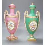 A pair of Coalport Coalbrookdale two handled vases with central oval panelled floral painting and