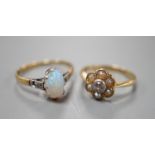 An 18ct and Plat, split pearl and diamond cluster set ring, size F/G and a similar white opal set