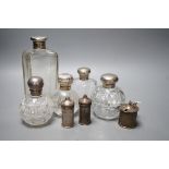 Three silver mounted glass scent bottles, a large silver mounted glass toilet bottle and three