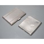 Two engine turned silver cigarette cases, largest 11.2cm, gross weight 10oz.