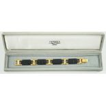 A boxed Hermes navy blue leather and gilt metal bracelet, 19cm.